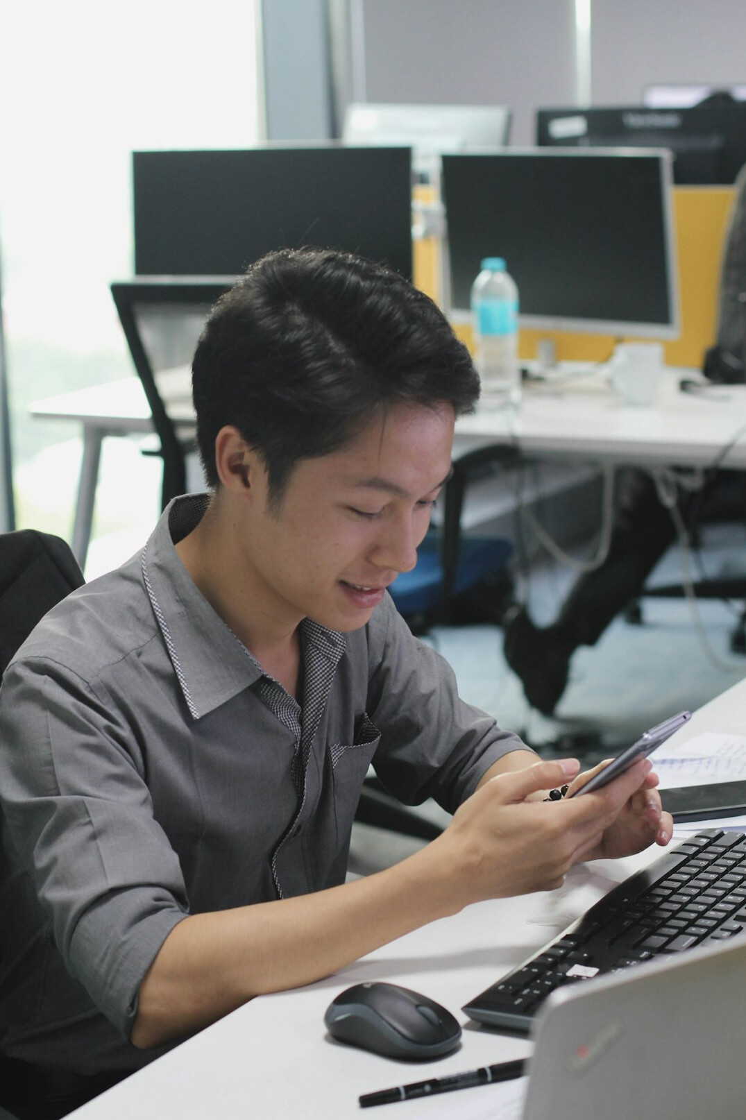 japanese programmer at desk