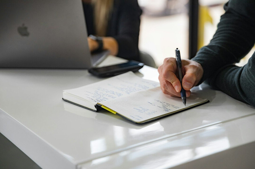 person writing notes